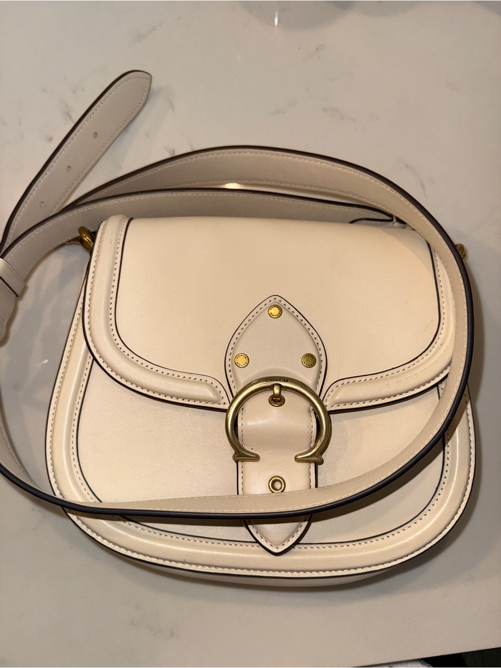 Coach Ivory Leather Crossbody with Gold Buckle in style “Coach Beat Saddle Bag”